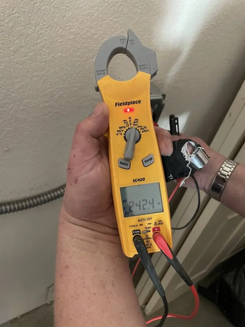 Voltage testing with clamp meter during Circuit Breaker Repair in Fort Morgan